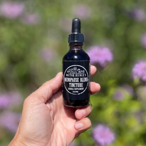 hand holding Nicole s Apothecary Menopause Blend Tincture