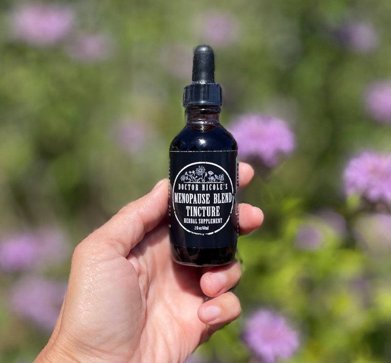 hand holding Nicole s Apothecary Menopause Blend Tincture